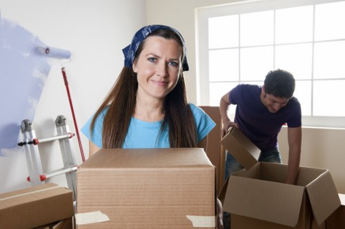 Packed office boxes and equipment prepared for relocation in Brent