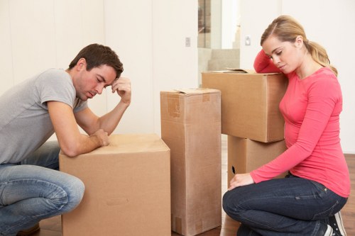 Professional movers loading items from a flat in Brent