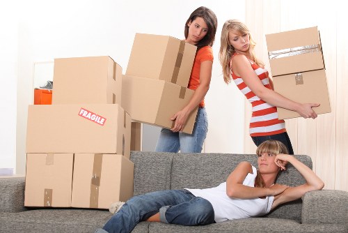 Careful loading of large furniture for transport in Brent