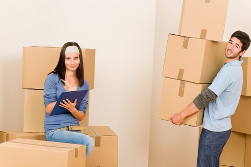 Packed office furniture ready for relocation in Brent